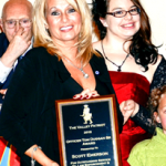 Sharon Birchall President of the Lawrence Exchange Club  accepts award on behalf of Scott Emerson