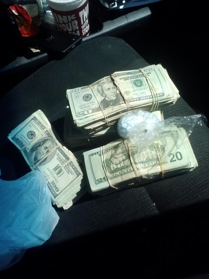 Car stop leads to three arrests and seizure on drugs and cash.