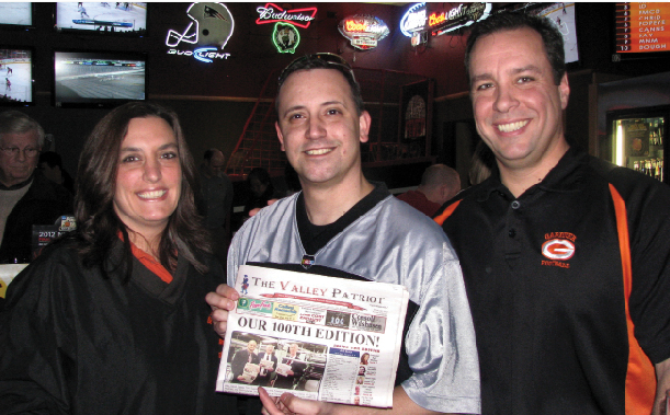 Gardner City Councilor Christine Ducharme Wilson, State Rep. Rich Bastien (R), and Gardner Mayor Mark Hawke hanging out with their copy of The Valley Patriot’s 100th edition just before The Blazin’ Challenge kicked off. Mayors from Fitchburg, Gardner and Leominster competed to see which team could eat the most Blazing Wings (out of 36). Leominster Mayor Dean Mazzarella’s teamteam won with 33 wings. The event was  held at Buffalo Wild Wings Bar & Grill on Whalom Street.