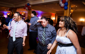 AAmerican Training Guests Carlos Mendoza, Gualberto “Tito” Rodriguez, and Fransuas Gonzalez laugh and smile as they dance the night away at American Training’s second annual Celebrate Good Times Gala, held May 16 at the Andover Country Club. Photo by Felix Khut.