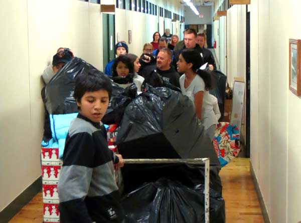 More than 300 Needy Children Wake up to Find Christmas Presents Thanks to Methuen Police, Fire & Teen Volunteers at Debbie’s Treasure Chest