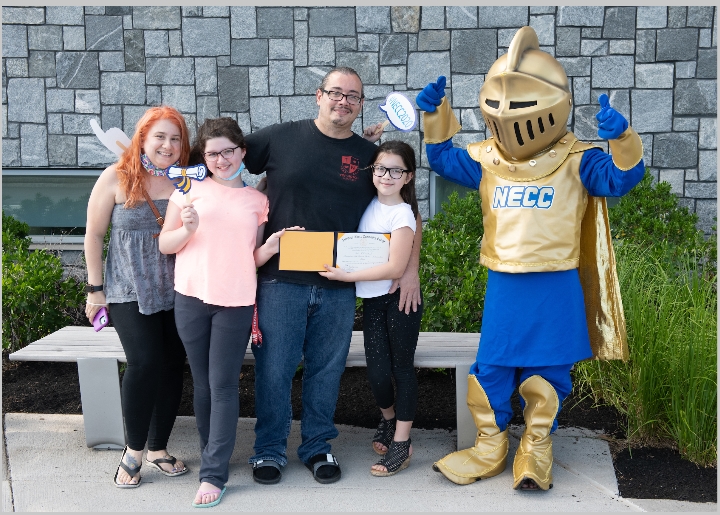 Commencement Carlos: 2020 NECC Graduate Carlos Schmidt of Haverhill and his family had their photo taken with the Northern Essex Knight mascot at last June’s celebration package pick up on the Lawrence Campus.
